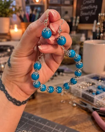 Handmade blue beaded bracelet and matching silver earrings